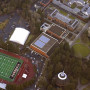 An aerial view of campus shows a solar panel system on the roof of the Pamplin Sports Center.
