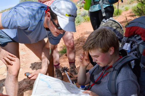 Map and compass skills take time to master in Utah's slickrock canyon terrain.
