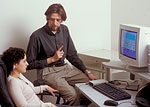 Julianne Muto '05 and Gary Howarth '06 simulate an EEG biofeedback training session.