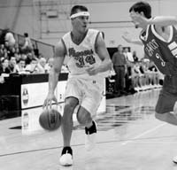 Sophmore center Colin Oriard, a Hispainc studies major from Corvallis, dribbles around a Whitman defender. Oriard will play on the seccon...
