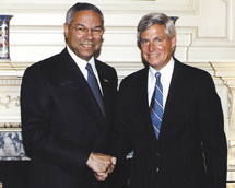 Secretary of State Colin Powell greets Ambassador Charles J. (Butch) Swindells '64.