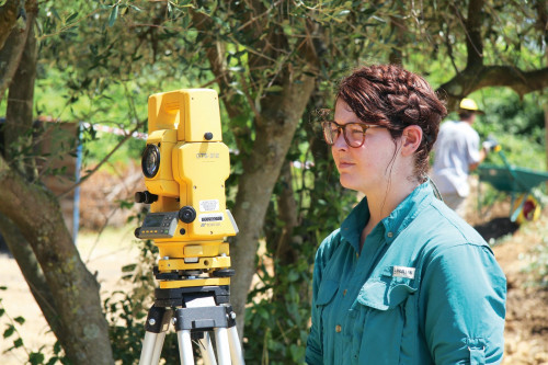 Grace Birdwell CAS '16 uses surveying gear to document the excavations.