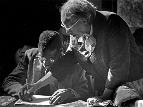 Septima Clark, co-founder of SCLC's Citizenship Education Project, works one-on-one to teach a man how to write. Camden, Alabama, 1966.