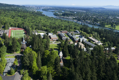 Aerial of campus with the Willamette River and Portland in the background.