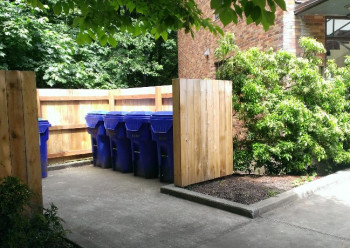 Image of blue commingled recycling bins.