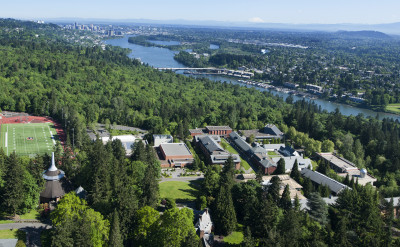 Aerial view of campus taken in 2016 showing the Willamette river and downtown Portland in the background.