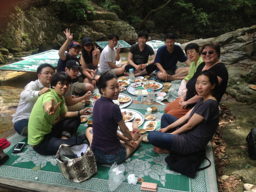 Prof. Aubrey Baldwin shares a picnic with Kangwon U. law students at Soyang Lake in Korea last summer