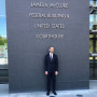 Michael Benjamin Smith '21 in front of the James A. McClure Federal. Building & United States Courthouse.
