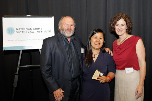 NCVLI Founder Doug Beloof and NCVLI Executive Director Meg Garvin honor Chanpone Sinlapasai with the 2013 Gail Burns-Smith Excellence in ...