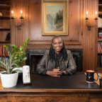 Robin Holmes-Sullivan at a desk in the Frank Manor House