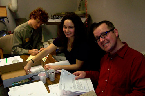 Admissions counselors Zach Kearl, Lauren Brown, and Peter McKay grin and bear it as the files just keep coming.