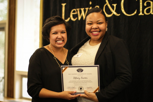 Angela Buck (left) presented Tiffany Farmer (right) with the Ray Warren Leadership Award at the IME Banquet on April 5, 2017.