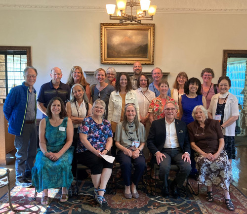 Gathering of former AES faculty, staff, directors, and alumni at the Manor House during Alumni Weekend in 2022.