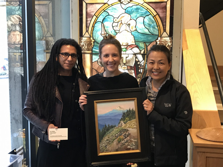 Pictured left to right: Tammy Jo Wilson, Jenna Barganski of Clackamas County Historical Society, and Elo Wobig Artist with painting Road...