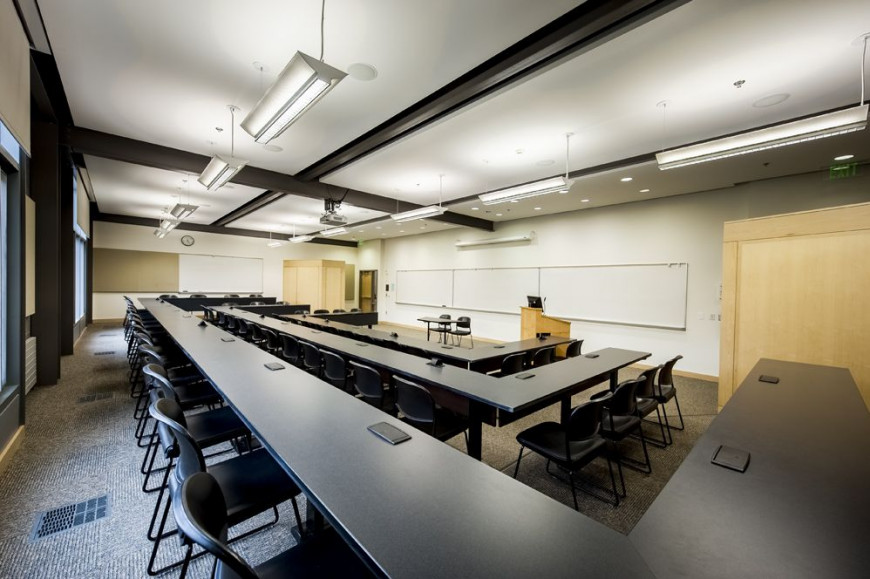 Welcome to the modern classroom: tiered seating, built-in AV, a speaker lectern, and plenty of whiteboard space. 