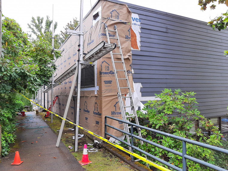 Another side of Fir Acres Theater Siding Bring Replaced