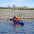 Two kayakers practice maneuvers