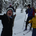 Students learn to Cross-Country Ski on a snowy forest trail