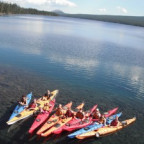 Picture shows students on sea kayaks. 