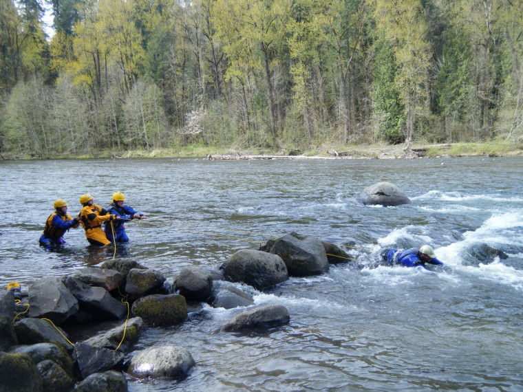Saving a trapped instructor serves to teach participants crucial skills in the Swiftwater Rescue Clinic.