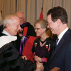 Upon receiving his honorary degree from Lewis & Clark, Shelby Davis is congratulated by Vice ...