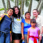 Lucy Roberts CAS ?14 and Mia McLaughlin CAS ?14 with their host family in El Salvador.