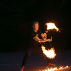 Associate Professor of Computer Science Peter Drake enjoys fire dancing.