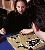 Above: Amanda Venghaus '04 plots her next move against Peter Drake, assistant professor of computer science.