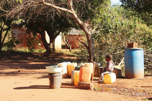 Fetching water from a community tap.