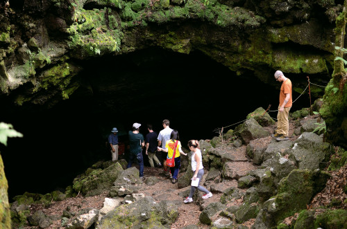 Students enter one of Fuji's lava tubes.