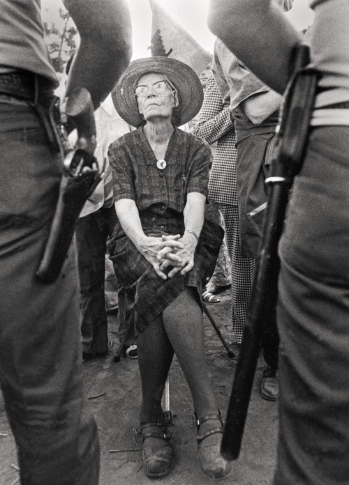 Dorothy Day, co-founder of the Catholic Worker Movement, practices nonviolent resistance at a UFW picket. When arthritis made standing di...