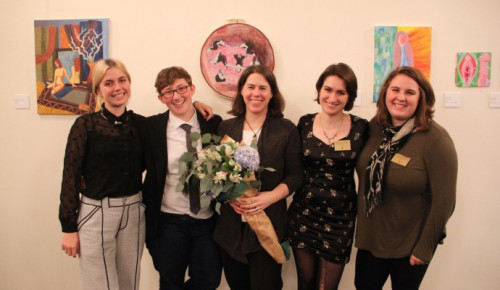 Symposium director Kim Brodkin (center, with flowers) with student cochairs Hannah Daniels, Alexa Jakusovszky, Em Schuler, and Anya Hall