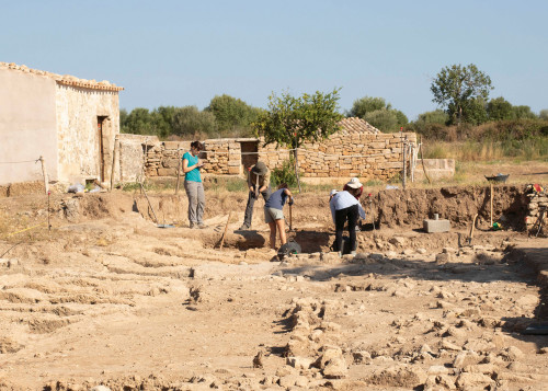 Students excavate bones, pottery, and other artifacts in the ancient ruins of Pollentia, a city founded more than two millennia ago.