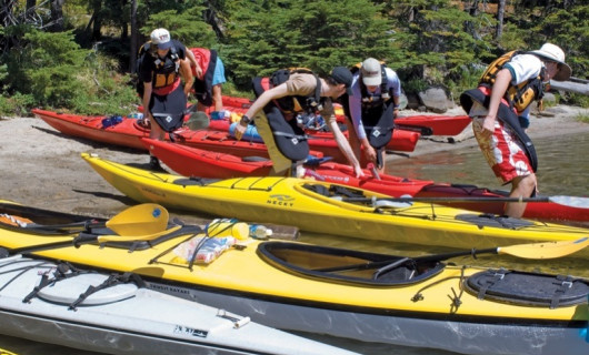 Carrie LaBaron '10, Eric Buzzard '10, Hannah Satein '10, and Alex Broom '10 ready their kayaking gear.