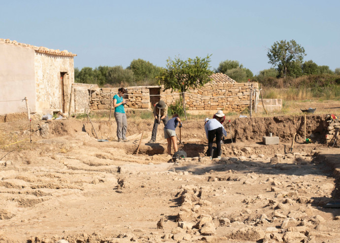 Students excavate bones, pottery, and other artifacts in the ancient ruins of Pollentia, a city f...
