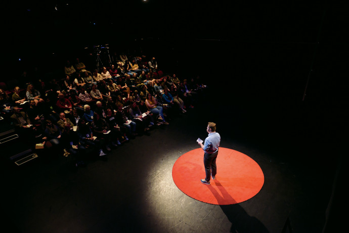 TEDx speaker Tom Stratton BA '20 in the Black Box Theatre.
