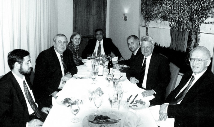Russia's minister of atomic energy, Aleksandr Rumyantsev (second from left), at a 2002 dinner for Thomas Neff (second from right). Rumyantsev and Neff worked together on the uranium purchase agreement.