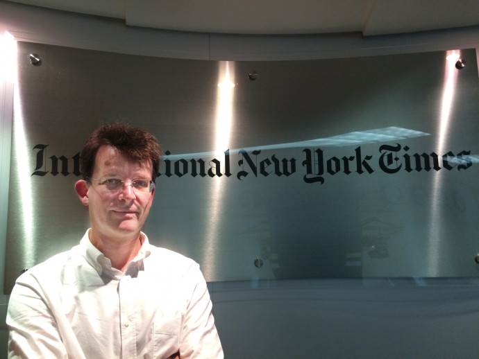 Philip McClellan BA ?91 at the International New York Times office in Hong Kong.