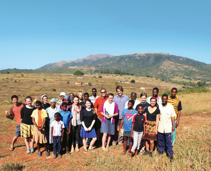 Students and sponsors at a rural homestead stay in Ngebeni.