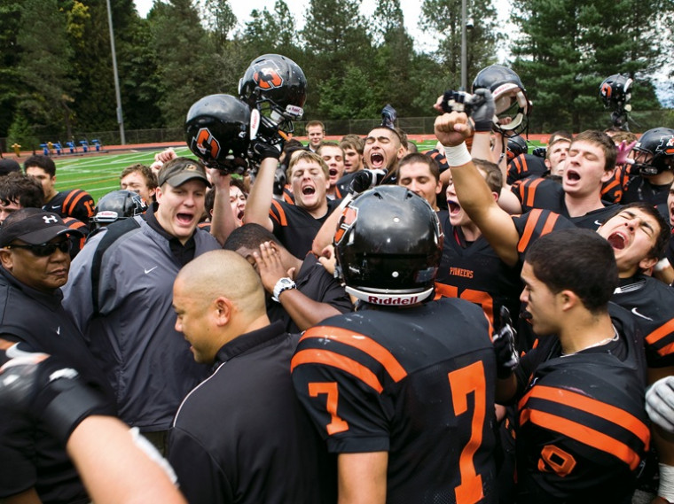 The Pioneers celebrate their 31-28 Homecoming win over Puget Sound.