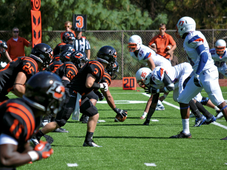 The Pioneer offense prepares for another drive in their home game against Macalester.