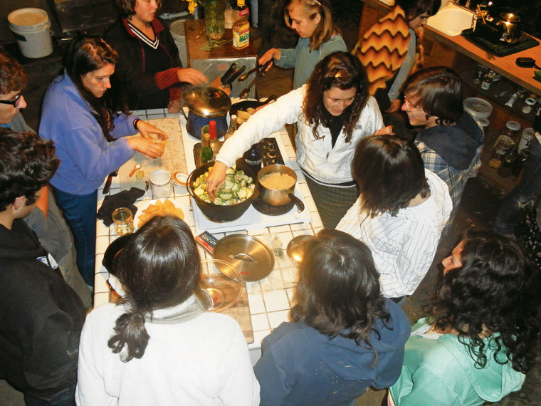 Members of the PEAS community learn to cook locally harvested food at Tryon Life Community Farm.