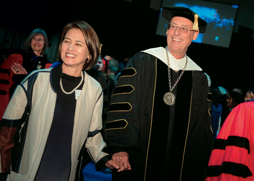 President Wiewel and wife Alice depart the inauguration ceremony in 2017 amid cheers from well-wi...