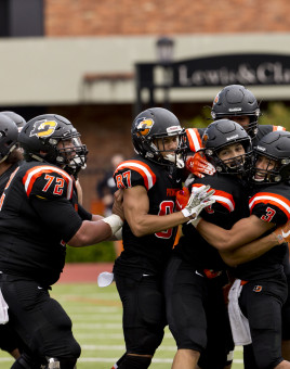 Lewis & Clark football players celebrating a touchdown.