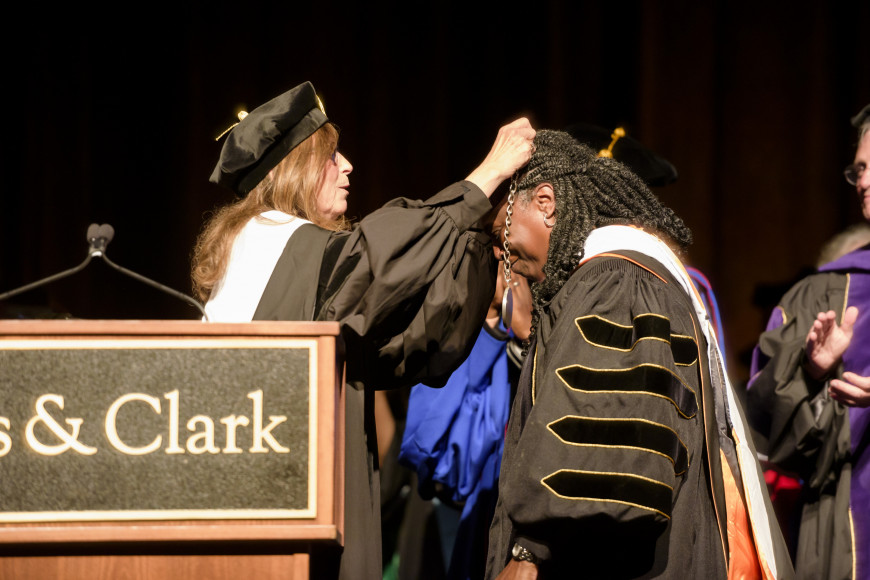 Lewis & Clark Board of Trustees Chair Stephanie Fowler placing the presidential chain of office on President Holmes-Sullivan.