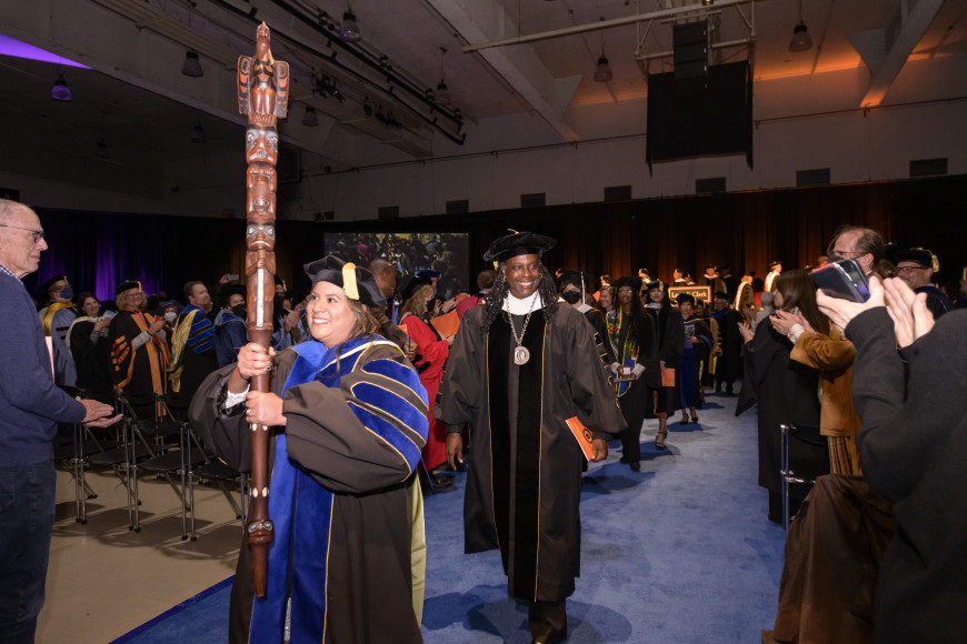 Dean of Equity and Inclusion Danielle Torres leads President Holmes-Sullivan and the procession out of the ceremony