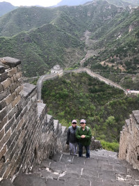 Hong Ai '97 and Dean Jennifer Johnson make the steep climb up the Great Wall.