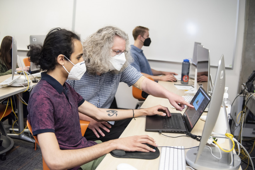 Associate Professor of Computer Science Peter Drake works with students and faculty from other de...
