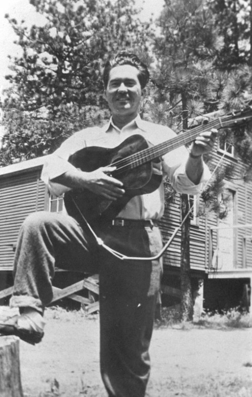 William Stafford with a guitar at the Los Prietos, California Civilian Public Service camp for WWII conscientious objectors.