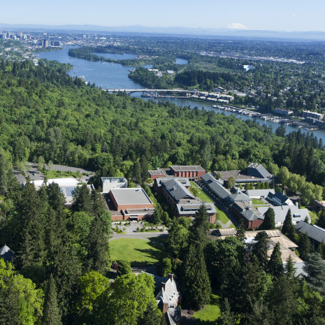Aerial view of campus taken in 2016 showing the Willamette river and downtown Portland in the background.